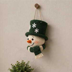 Crochet Snowman Wall Hanging Pattern, Christmas Door Decor, Amigurumi Snowman PDF, Winter Holiday Crochet Pattern, Handmade Decor
Christmas Ornament Crochet Pattern PDF, Snowman Wall Hanging, Amigurumi Holiday Decor, Instant Download 
Crochet Snowman Wreath Pattern, Christmas Wall Hanging Decor (PDF Download)