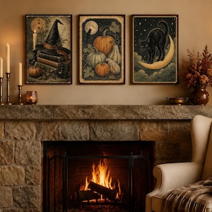 May include: Three rectangular wall art prints displayed above a stone fireplace. The left print shows a witch hat on books, the center print features various pumpkins, and the right print depicts a black cat perched on a crescent moon.