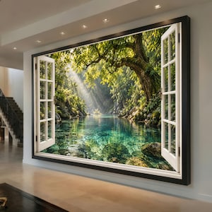 May include: A large rectangular wall art piece featuring a trompe l'oeil window design with white frames opening onto a sunlit forest scene. The view shows a clear turquoise river, mossy rocks, and a large tree with light rays filtering through.