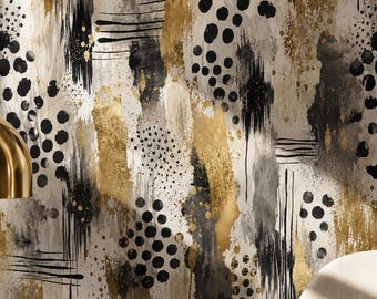 May include: Wallpaper featuring an abstract pattern with black circular dots, vertical black brushstrokes, and metallic gold paint accents on a light beige background. The design includes varied textures and overlapping layers of paint.