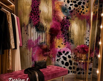 May include: A tufted magenta velvet bench with a black quilted handbag and a black garment draped on top. The wall features a vibrant abstract mural with gold paint streaks, pink splashes, and black leopard spots. Text reads Design 1.