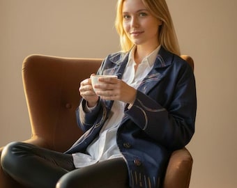 Hand-embroidered navy blazer, made in Marrakech. One-of-a-kind piece — no two are ever the same.