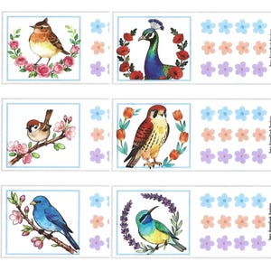 May include: A sheet of six rectangular stickers featuring watercolor illustrations of various birds including a peacock, sparrow, and bluebird, surrounded by floral wreaths and branches, accompanied by rows of small blue, peach, and purple flower icons.