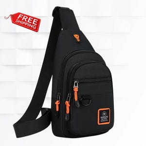 May include: A black sling backpack featuring a single adjustable shoulder strap, multiple zippered compartments with bright orange pull tabs, a black D-ring, and a square orange patch with the text Wanlifu Military Products on the front.
