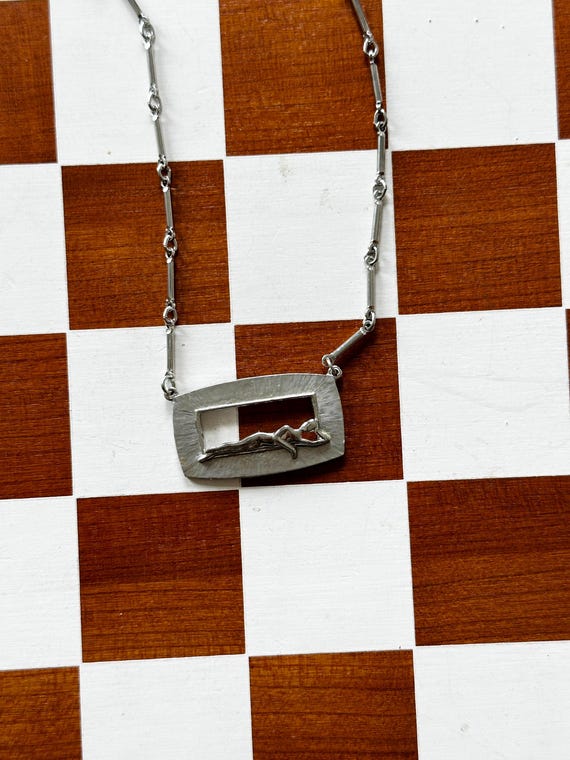 1980s Silver Reclining Figure Necklace | Length: 19"