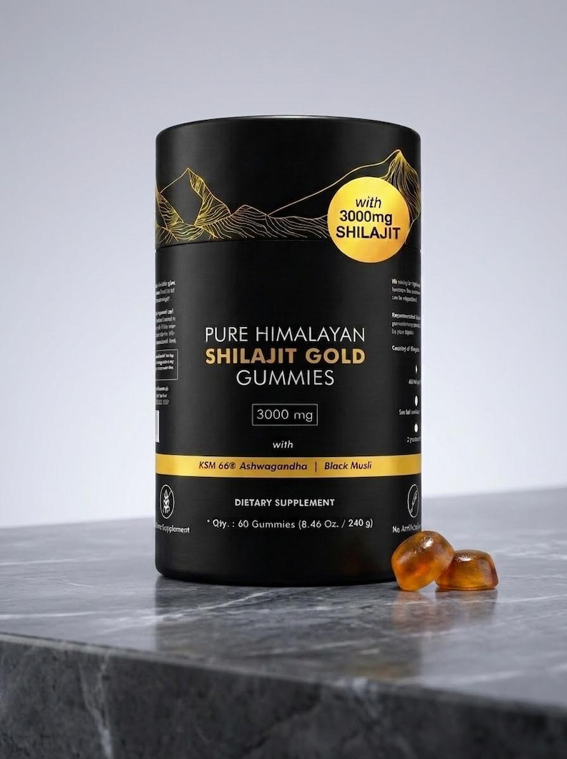 May include: A black cylindrical container of Pure Himalayan Shilajit Gold Gummies. The label features gold mountain graphics and text that reads "with 3000mg Shilajit". The container also lists ingredients and dietary supplement information. Two amber-colored gummies are in front.