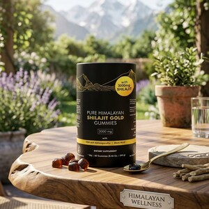 May include: A black cylindrical container of Pure Himalayan Shilajit Gold Gummies, with the text "3000 mg Shilajit" and "Dietary Supplement." Several gummies and a spoon are on a wooden table. The background features a mountain range and greenery.
