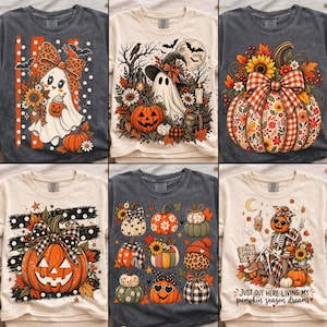 May include: A collection of six t-shirts featuring various autumn and Halloween designs, including ghosts with leopard print bows, pumpkins with floral patterns, jack-o'-lanterns, and a skeleton holding a coffee cup with the text Fall Vibes.