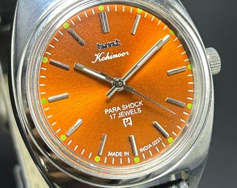Reloj de pulsera vintage HMT Kohinoor para hombre, con esfera naranja, cuerda manual, movimiento fabricado en India y 17 joyas.