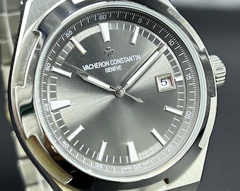 Reloj de pulsera de lujo para hombre VACHERON CONSTANTIN GENEVE, reacondicionado, con esfera gris, indicador de fecha, movimiento automático y correa de acero inoxidable.