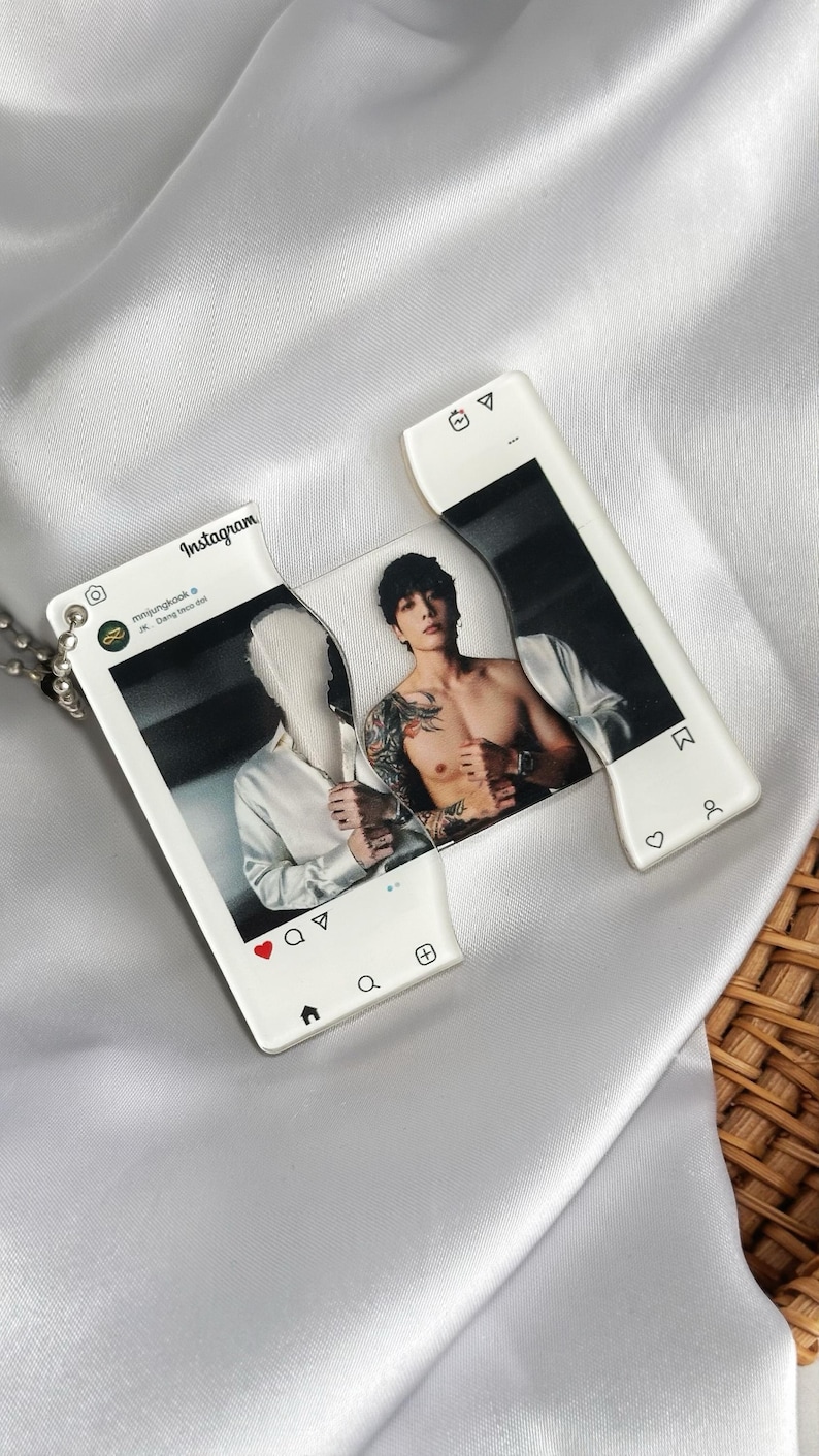 May include: A clear acrylic pendant with a photo of a person on an Instagram-style frame. The pendant has a silver chain. The photo shows a person with tattoos and a white shirt. The Instagram frame has the Instagram logo and icons.