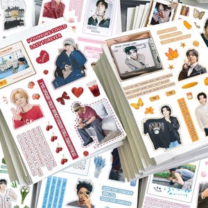 May include: A collection of decorative sticker sheets featuring various photographic portraits of individuals, graphic illustrations of cherries, hearts, butterflies, and autumn leaves, alongside printed text phrases like I THINK WE COULD LAST FOREVER.
