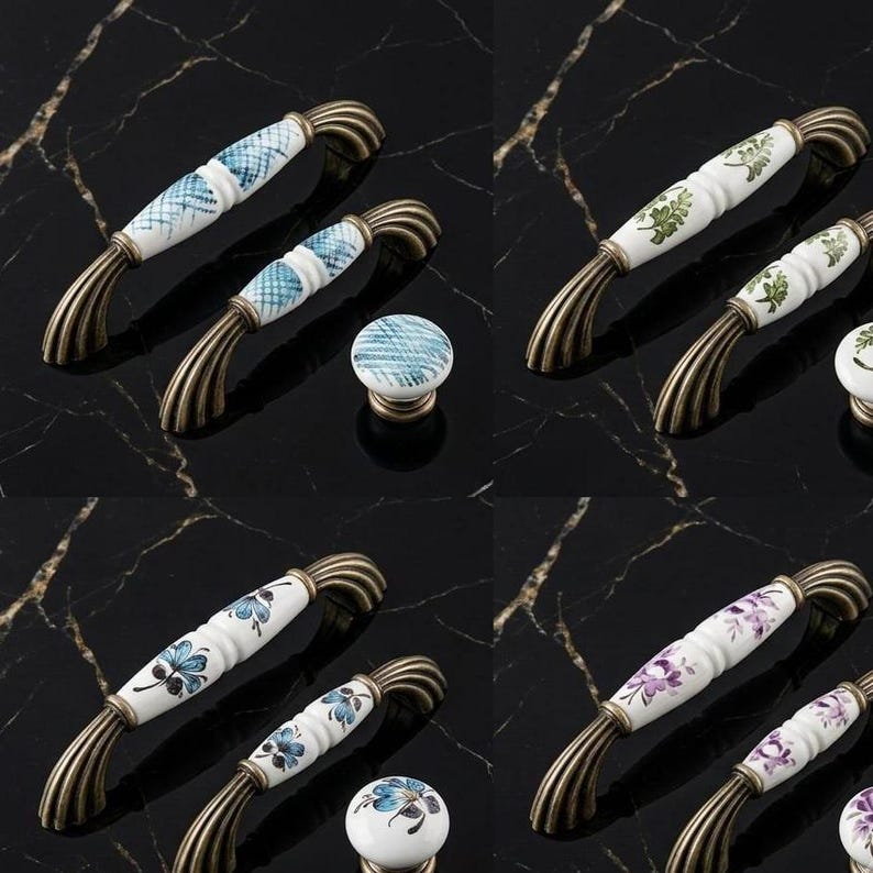 May include: A collection of ceramic cabinet hardware featuring arched handles and round knobs with antique bronze-toned metal ends. The white ceramic surfaces are decorated with various patterns including blue cross-hatching, green leaves, blue flowers, and purple floral motifs.