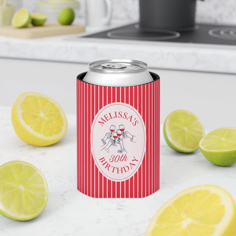 May include: A red and white vertical striped can cooler featuring a central oval emblem with the text Melissa's 30th Birthday and a graphic illustration of multiple hands holding up wine glasses for a toast in a celebratory design.