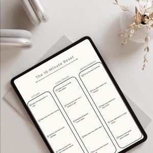 May include: A digital planner titled "5-PAGE ADHD CLEANING COMPANION" with the text "The 10-Minute Reset." The planner is on a tablet and includes cleaning checklists for the kitchen, living spaces, and bedroom/bath. A pink starburst graphic says "Canva Editable & Ready to Print!"