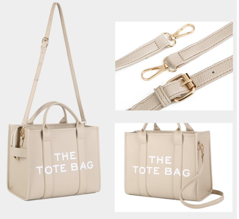 Pu&ograve; includere: Borsa tote beige con la scritta "THE TOTE BAG" in bianco. La borsa ha una tracolla e due manici. La borsa ha finiture color oro. La borsa &egrave; realizzata in un materiale liscio.