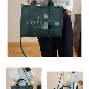 May include: A dark green tote bag with the word "TOTE" and "MARC J" printed on the front. The bag has two handles and a shoulder strap. The bag is made of a smooth material.