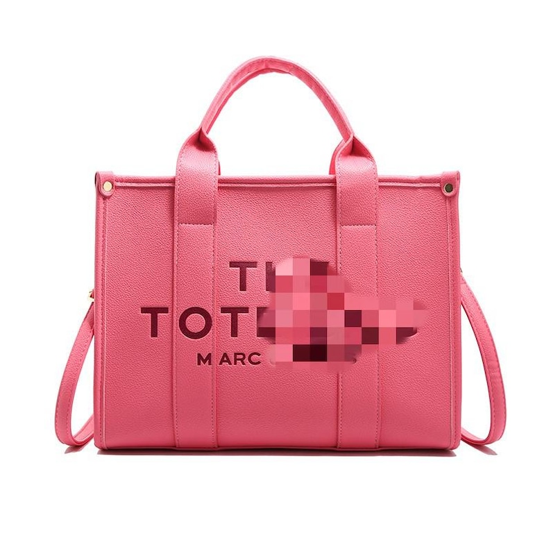 May include: A pink tote bag with a top handle and a shoulder strap. The bag has the word "TOTE" and "MARC" printed on the front. The bag is made of a smooth material and has a rectangular shape.