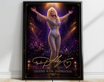 May include: A framed poster featuring a blonde performer in a shimmering, fringed silver jumpsuit with arms outstretched on a stage. The image includes the gold cursive text Dolly, a heart symbol, and the words LEGEND. ICON. INSPIRATION.