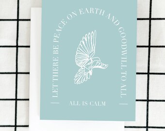 May include: A light blue card with a white dove and the text "Let there be peace on earth and goodwill to all. All is calm."
