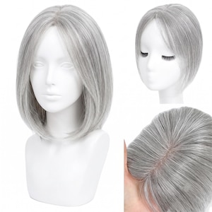May include: A silver-grey hair topper featuring a straight, shoulder-length bob cut with a centre part. The hairpiece displays natural-looking highlights and lowlights, with a visible monofilament base construction shown in the detailed view.