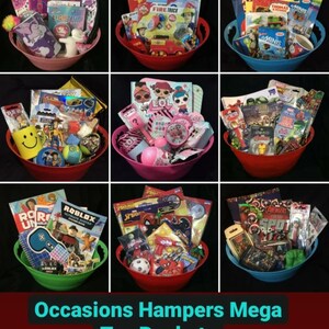 May include: Nine colorful toy buckets filled with various toys and books. Each bucket is a different color, including pink, red, blue, and green. The text "Occasions Hampers Mega Toy Buckets" is at the bottom of the image.