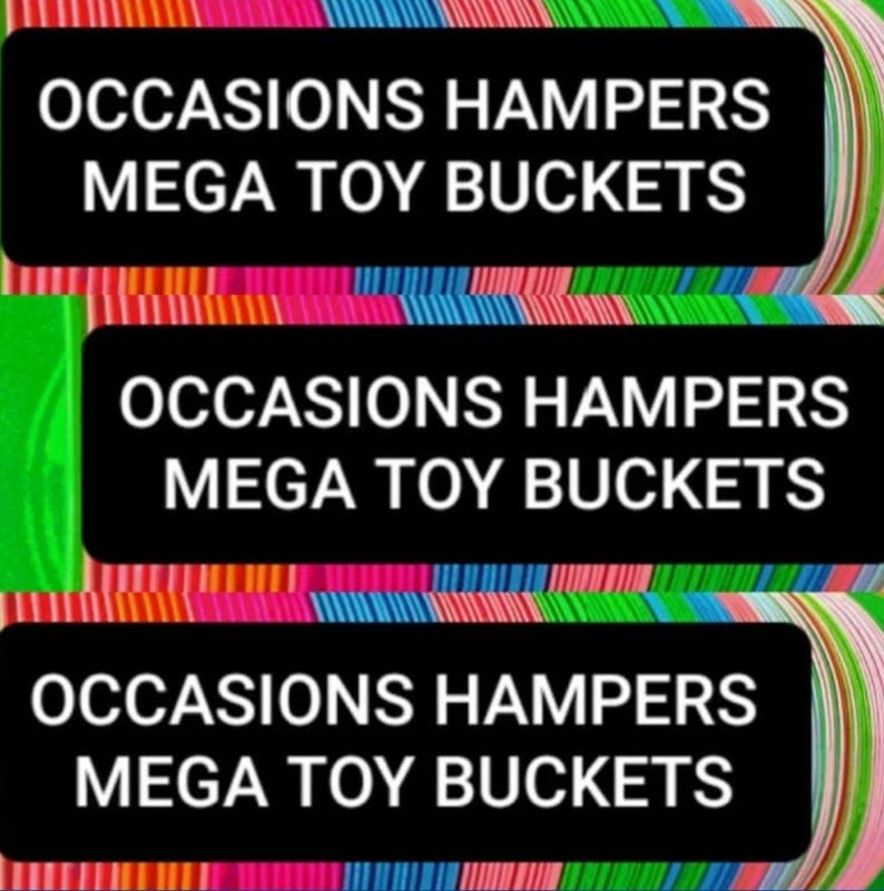 May include: Three black rectangles with white text that reads "OCCASIONS HAMPERS MEGA TOY BUCKETS". The background is a colorful array of rainbow-colored stripes.