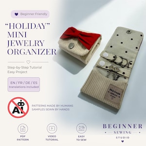 May include: A beige corduroy mini jewelry organizer featuring a red bow, a silver snap closure, and an open interior with black polka dots, white snap tabs for rings, and a rectangular label reading Beginner Sewing Studio.