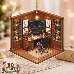 May include: A flat, two-dimensional hanging ornament depicting a home office with wood-panelled walls, a desk, a black office chair, and multiple computer monitors displaying stock market charts. The scene includes bookshelves, a rug, and text signs.