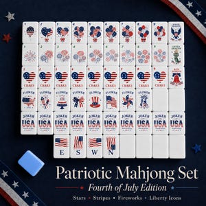 May include: A white mahjong tile set featuring patriotic American themes including red, white, and blue balloons, fireworks, heart-shaped flags, and liberty icons. The tiles display numbers, suits, and text such as Joker USA, Fourth of July, and 1776.