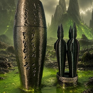 May include: A dark, metallic, cylindrical container with etched markings, next to a group of three stylized figures in a decorative holder. The objects are set in a swampy, green environment with a mountainous backdrop.