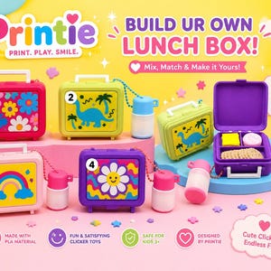 May include: A collection of miniature toy lunch boxes with handles and matching water bottles. Designs include colorful flowers, a blue dinosaur, and a rainbow. One purple lunch box is open, revealing small toy food items inside. Text reads Printie.