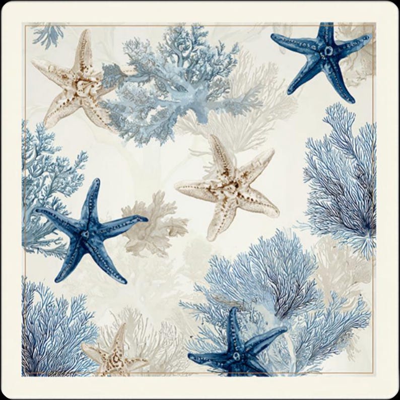 Close-up view of the white marine-themed mahjong mat, showcasing blue starfish, delicate coral patterns, and a clean framed border.