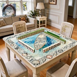 Summer beach surfboard mahjong mat shown in use with mahjong tiles, highlighting the spacious square playing area, smooth cushioned surface, and elegant ocean-themed artwork with a decorative surfboard, shell border, and flowing wave details.