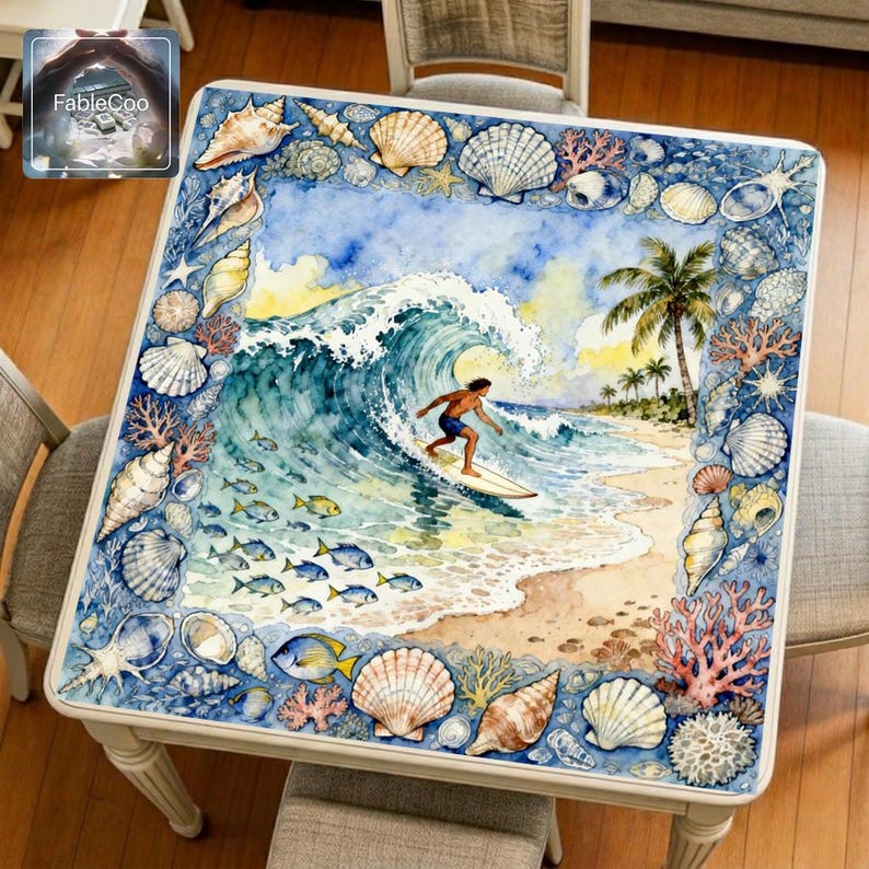 Summer surfing mahjong mat displayed on a square home table, featuring an original coastal design with a surfer riding a curling ocean wave, surrounded by seashells, coral, tropical shoreline details, and soft blue watercolor tones.
