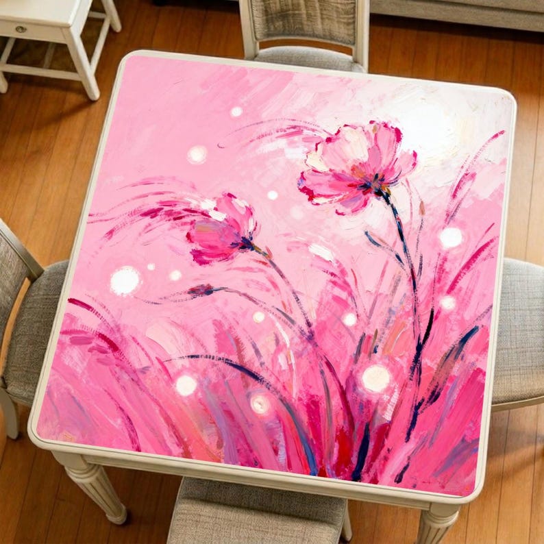 Original pink lotus art mahjong mat displayed on a square table, featuring expressive floral brushstrokes and a soft romantic color palette.