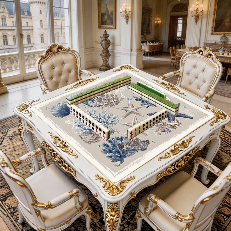 Decorative square game mat shown in use with mahjong tiles, highlighting the spacious playing surface and refined marine artwork.