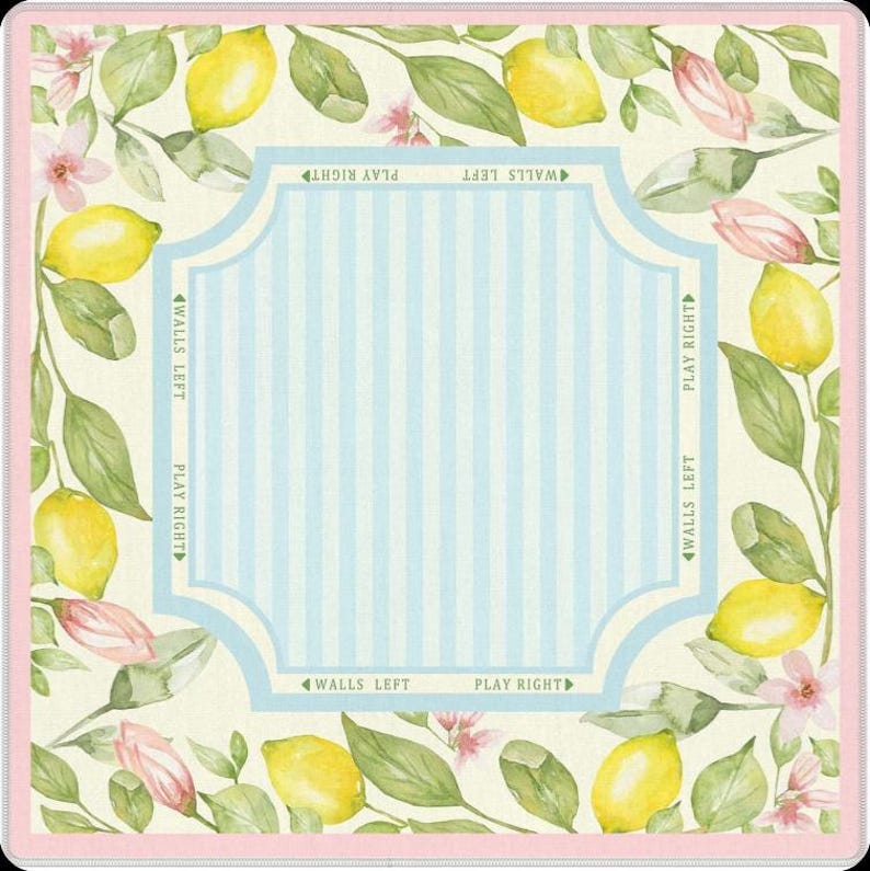 Full flat-lay product image clearly displaying the lemon artwork, botanical border, pastel color palette, striped center play area, and square format.