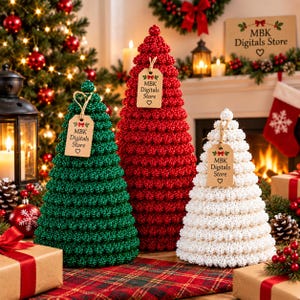 May include: Three cone-shaped Christmas tree decorations in green, red, and white, each covered in small textured beads. Each tree features a brown paper tag tied with twine that reads MBK Digitals Store with a small heart icon below the text.