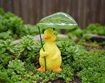 Figura decorativa de jardín con forma de animalito adorable y sombrilla de hojas, estatua de resina de pato/perezoso/erizo, miniatura decorativa resistente a la intemperie para jardín y patio.
