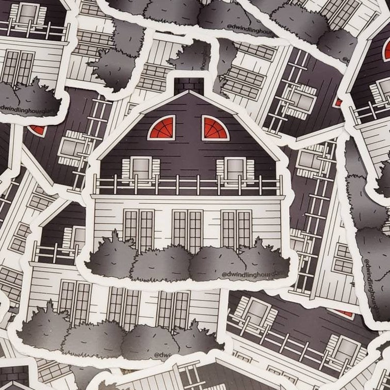 May include: A sticker featuring a black and white illustration of a house with a dark gray roof and red arched windows. The house has a white facade, a small balcony, and is surrounded by gray bushes. The sticker has the text "@dwindlinghours" on it.