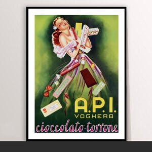 May include: Vintage framed poster featuring a woman surrounded by chocolates and candies. The poster has a green and yellow background with the text "A.P.I. VOGHERA cioccolato-torrone" in bold letters. The woman is wearing a pink and white dress.