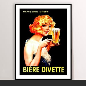 Könnte beinhalten: Gerahmter Vintage-Poster-Druck. Es zeigt eine Frau mit orangefarbenem Haar, die ein Bierglas hält. Das Poster trägt oben "BRASSERIE GREFF" und unten "BIÈRE DIVETTE" auf schwarzem Hintergrund.