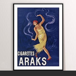 May include: Vintage poster print featuring a woman in a flowing yellow dress and red headscarf, holding cigarettes with smoke trails against a dark blue background. The poster reads "CIGARETTES ARAKS" in bold white letters.