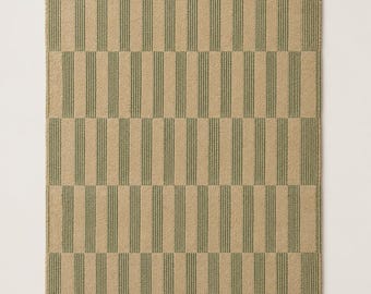 May include: Tan rectangular rug with vertical stripes in olive green. The rug has a repeating pattern of alternating solid tan and striped sections. The edges of the rug have a notched design.