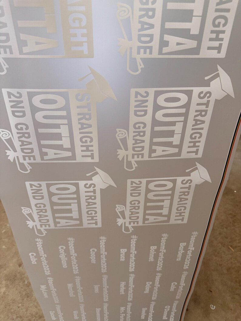 May include: A sheet of white adhesive stickers featuring the text STRAIGHT OUTTA 2ND GRADE with a graduation cap and diploma icon. Below each sticker, the hashtag #teamForte2026 is printed alongside various individual names in a list format.