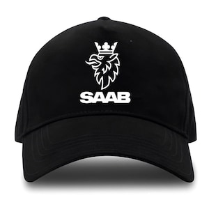 May include: Black baseball cap featuring a white graphic of a crowned griffin and the word "SAAB" in a bold, sans-serif font. The cap has a curved brim and a structured crown, suitable for casual wear.