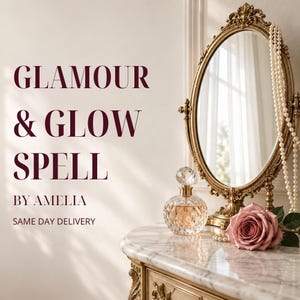 May include: An oval gold-framed mirror, a crystal perfume bottle, and a pink rose on a marble surface. The text reads: GLAMOUR & GLOW SPELL BY AMELIA. A long string of white pearls hangs from the side of the mirror frame, reflecting light.