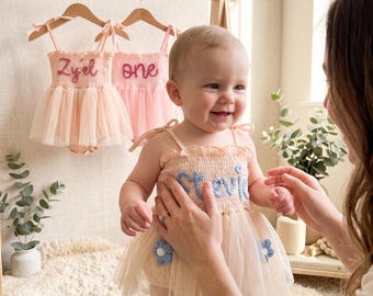 Customized baby girl onesies, cake-smashing outfits, birthday sets, newborn gifts, baby photography sets, ballet tutus, onesies.