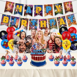 May include: A Masters of the Universe themed party decoration set featuring a Happy Birthday banner with character illustrations, assorted colorful balloons with printed graphics, and a cake topper with a Happy Birthday sign.